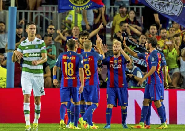 Lionel Messi and team-mates celebrate their 7-0 victory over Celtic at the Nou Camp.
