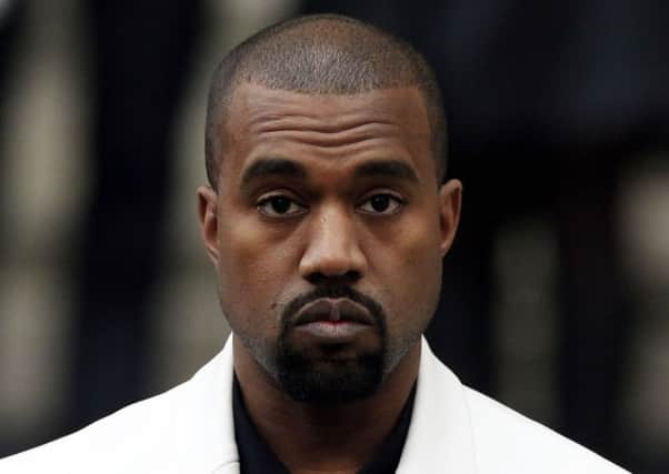 Kanye West has reportedly been admitted to hospital for exhaustion, a day after cancelling his tour. Picture: PA