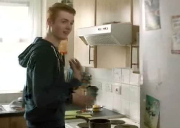 Still taken from video issued by the ASA of a Heinz advert that teaches viewers how to use tin cans to drum out a song which has been banned for encouraging behaviour that risks health and safety.