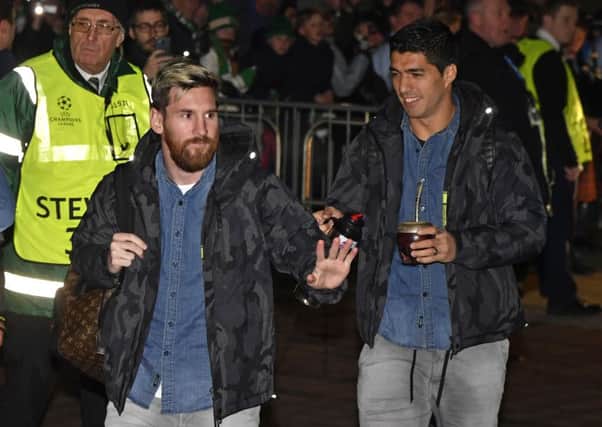 Lionel Messi and Luis Suarez arrive at Celtic Park ahead of the game. Picture: SNS