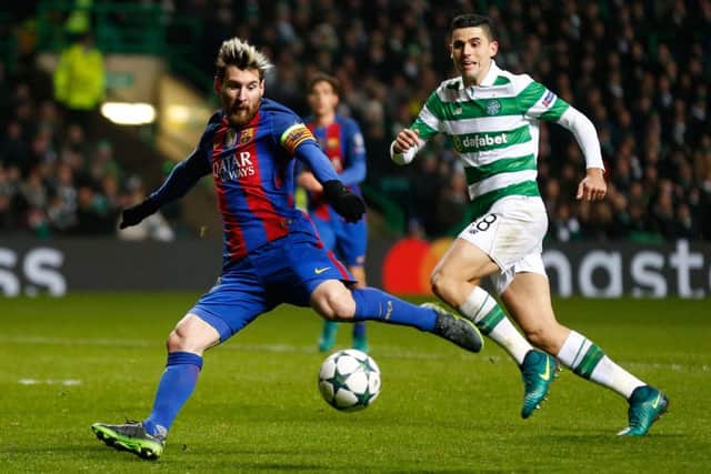 Tom Rogic looks on helplessly as Lionel Messi opens the scoring for Barcelona. Picture: PA