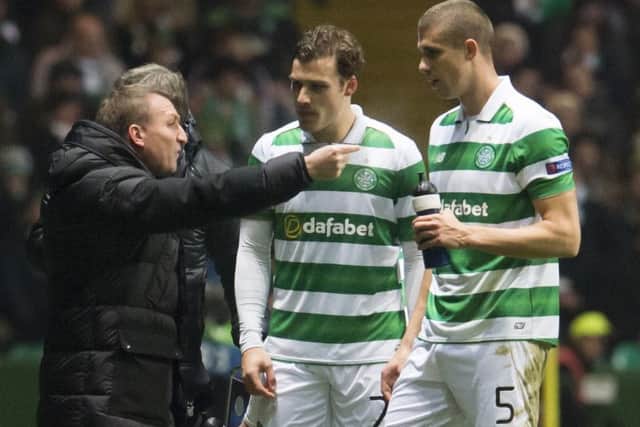 Celtic manager Brendan Rodgers issues instructions to Jozo Simunovic, right, and Erik Sviatchenko. Picture: SNS Group