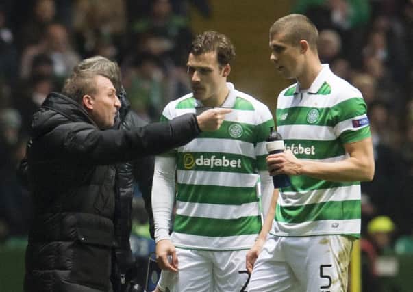 Celtic manager Brendan Rodgers issues instructions to Jozo Simunovic, right, and Erik Sviatchenko. Picture: SNS Group