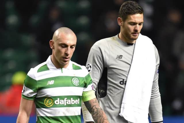 The Celtic captain, left, and Craig Gordon exit the field after the 2-0 defeat. Picture: SNS