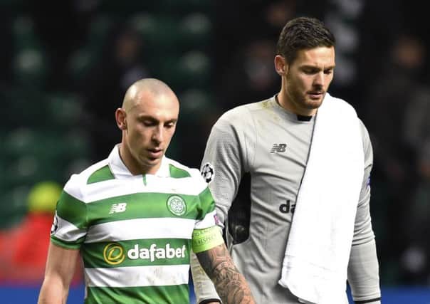The Celtic captain, left, and Craig Gordon exit the field after the 2-0 defeat. Picture: SNS