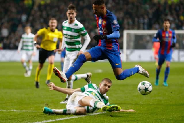 Barcelona's Neymar takes to the air to hurdle sliding Celtic defender Jozo Simunovic. Picture: Owen Humphreys/PA Wire
