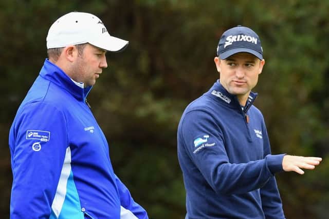 Duncan Stewart and Russell Knox chat ahead of the 2016 World Cup of Golf in Melbourne, Australia. Picture: Getty