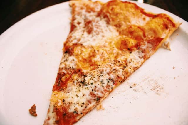 The woman tried to use a slice of pizza instead of ID. Picture (posed by model): Pixabay