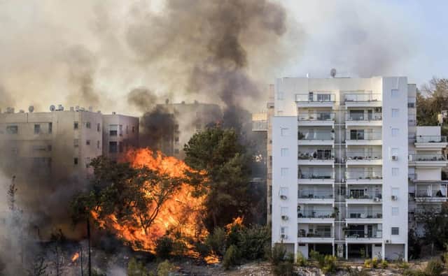 Hundreds of Israelis fled their homes on the outskirts of the countrys third city, Haifa,  in the face of advancing wildfires. Picture: AFP/Getty Images