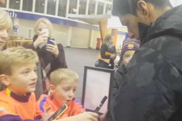 Luis Suarez stops to sign autographs for the youngsters. Picture: Contributed