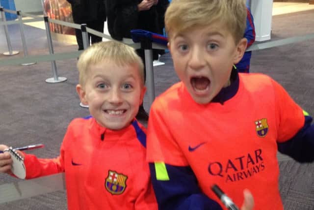 Leo Conway (left) and Callum Adamson were ecstatic after meeting their heroes at Prestwick Airport. Picture: SWNS