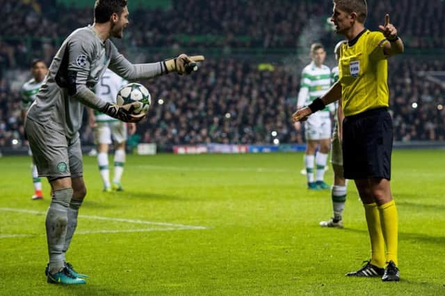 Celtic goalkeeper Craig Gordon speaks with Referee Daniele Orsato during the 2-0 defeat by Barcelona. Picture: Craig Williamson/SNS