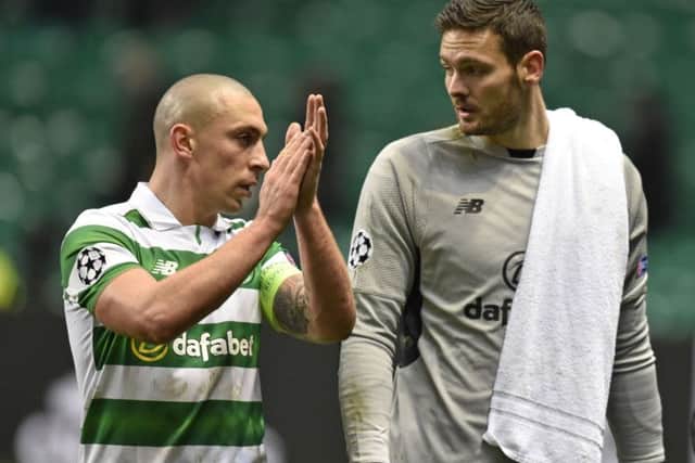 Celtic's Scott Brown and Craig Gordon applaud the supporters at full time after the defeat by Barcelona in the Champions League. Picture: Rob Casey/SNS