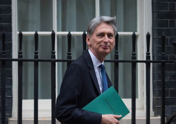 Chancellor Philip Hammond leaves Downing St to make his Autumn Statement