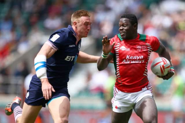 Scotlands Dougie Fife closes in on Alex Olaba of Kenya during a pool match at Twickenham. Picture: Getty