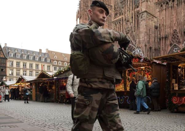 A French soldier patrols in the Christmas market area near the Cathedral in Strasbourg, eastern France on its opening day. Picture: AFP/Getty Images