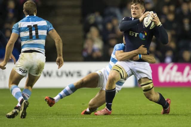 Magnus Bradbury  is tackled by Matias Moroni in last week's victory over Argentina. Picture: SNS/SRU.