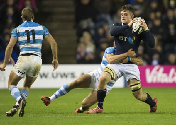 Magnus Bradbury  is tackled by Matias Moroni in last week's victory over Argentina. Picture: SNS/SRU.