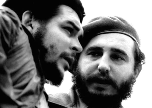 Then Cuban Prime Minister Fidel Castro (R) stands side by side with Argentine guerrilla leader Ernesto Che Guevara in the 60s. 
Picture: Getty
