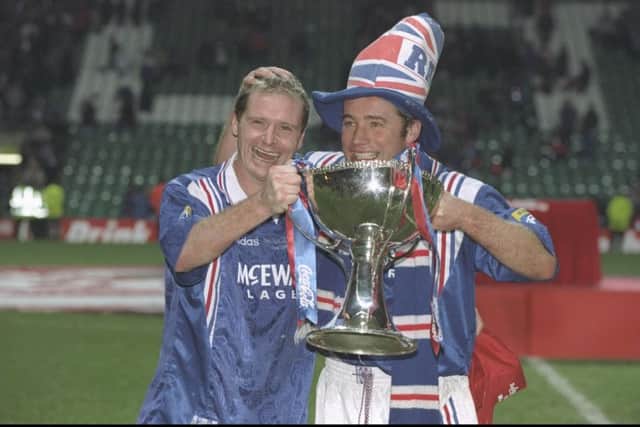 Paul Gascoigne, left, who scored twice, and Ally McCoist celebrate with the Scottish League Cup trophy at Celtic Park.