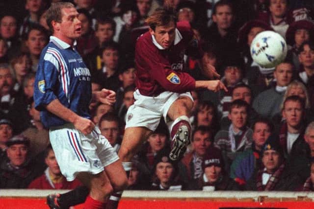 Hearts' Neil McCann, right, unleashes a strike at goal after escaping the attention of Rangers' Paul Gascoigne.