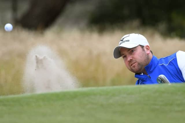 Duncan Stewart of Scotland hits out of the bunker during the third day of the World Cup of Golf. Picture: AFP/Getty Images