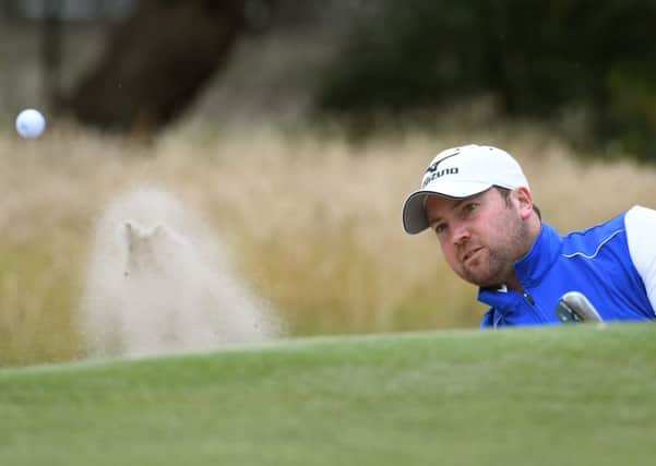 Duncan Stewart of Scotland hits out of the bunker during the third day of the World Cup of Golf. Picture: AFP/Getty Images