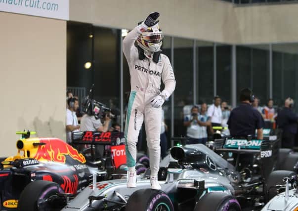 Mercedes' Lewis Hamilton celebrates qualifying in pole position at Yas Marina Circuit, Abu Dhabi. Picture: David Davies/PA Wire