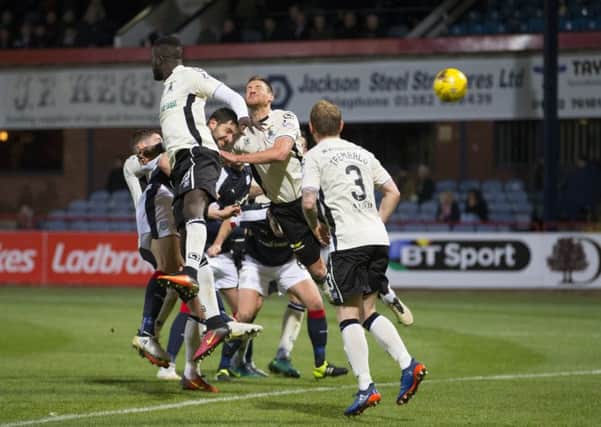 Dundee's Kostadin Gadzhalov (centre) scores his side's second goal in their 2-1 victory over Inverness at Dens Park. Picture: Kenny Smith/SNS