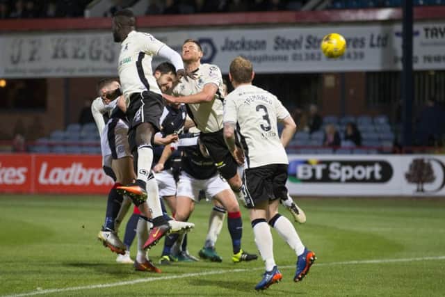 Dundee's Kostadin Gadzhalov (centre) scores his side's second goal in their 2-1 victory over Inverness at Dens Park. Picture: Kenny Smith/SNS