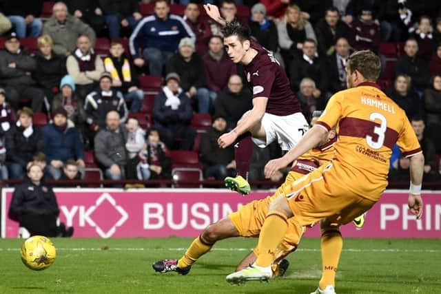 Jamie Walker fires home Hearts third goal in yesterdays comfortable victory at Tynecastle. Picture: Rob Casey/SNS