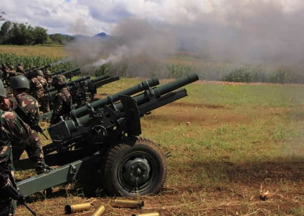 Philippine troops fire their 105mm howitzer cannons towards enemy positions. Picture; Getty