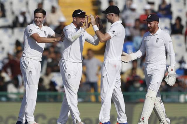 England celebrate the dismissal of India's Karun Nair on the second day of the third Test in Mohali. Picture: AP Photo/Altaf Qadri