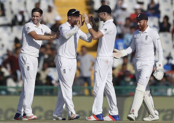 England celebrate the dismissal of India's Karun Nair on the second day of the third Test in Mohali. Picture: AP Photo/Altaf Qadri