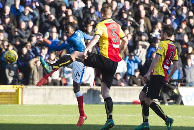 Joe Dodoo scores his Rangers' first goal against Partick Thistle. Picture: SNS.