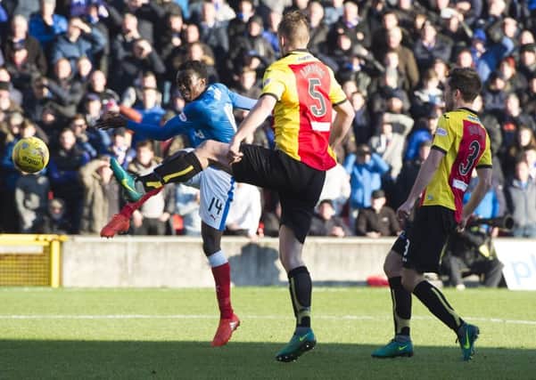 Joe Dodoo scores his Rangers' first goal against Partick Thistle. Picture: SNS.