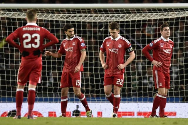 Aberdeen players James Maddison, Anthony O'Connor, captain Ryan Jack and Kenny McLean stand dejected after their side went 3-0 down. Picture: Rob Casey/SNS