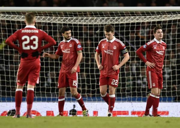 Aberdeen players James Maddison, Anthony O'Connor, captain Ryan Jack and Kenny McLean stand dejected after their side went 3-0 down. Picture: Rob Casey/SNS