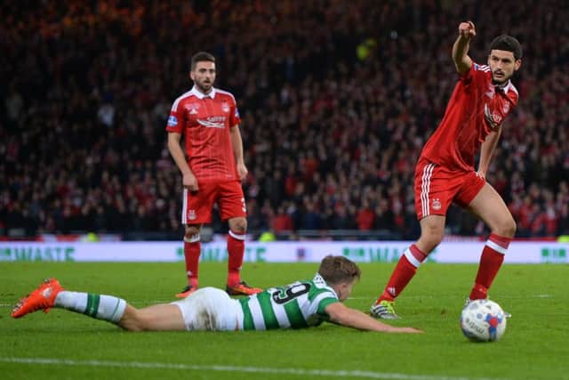 Anthony O'Connor, right, fouls James Forrest inside the penalty area. Picture: Getty