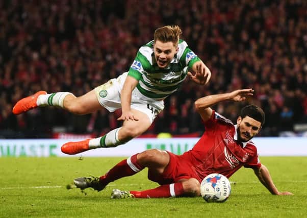 James Forrest, left, is fouled by Aberdeen defender Anthony O'Connor inside the penalty area. Picture: SNS