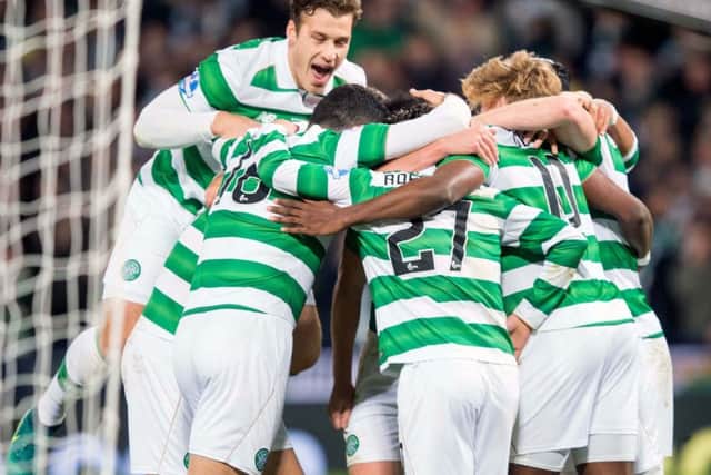 Celtic players celebrate after Moussa Dembele puts his side 3-0 up. Picture: PA