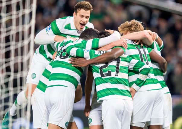 Celtic players celebrate after Moussa Dembele puts his side 3-0 up. Picture: PA