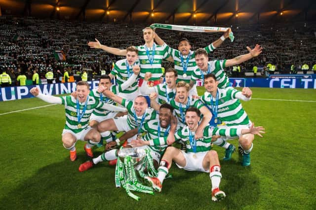 Celtic's players celebrate after the full-time whistle. Picture: PA