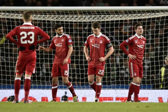 Aberdeen's stars stand dejected after Celtic go 3-0 ahead. Picture: SNS