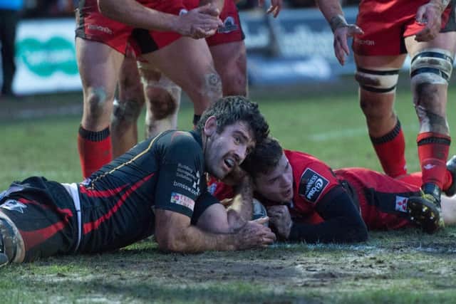 Chris Dean, right, scores for Edinburgh despite Nick Crosswells attentions. Picture: Simon Latham/Andrew Orchard