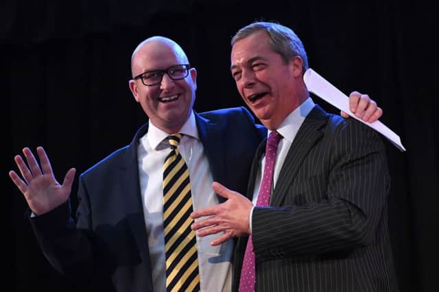 Paul Nuttall  is congratulated by Nigel Farage after he was announced as the new Ukip leader. Picture; Stefan Rousseau/PA