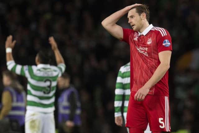 Dejection for Aberdeen's Ash Taylor as his side lose the League Cup final to Celtic. Picture: SNS