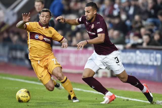 Faycal Rherras, right, cleared three efforts off the goal-line for Hearts. Picture: SNS
