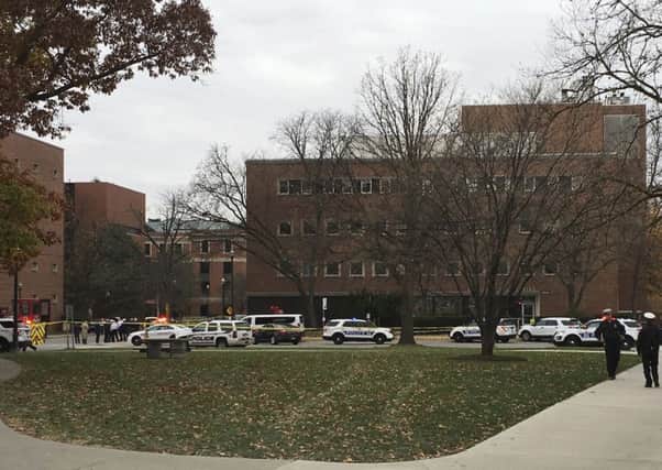Police respond to reports of an active shooter on campus at Ohio State University. (AP Photo/Andrew Welsh-Huggins)