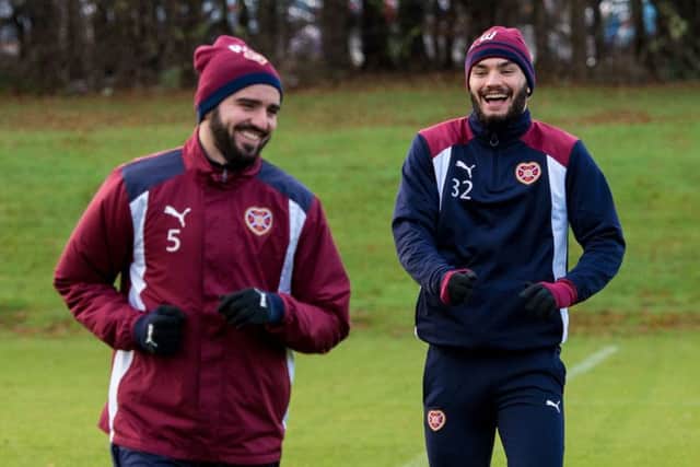Could Alim Ozturk, left, and Tony Watt be two players Hearts are looking to move in January? Picture: SNS